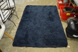 A Heals blue rug, 180cm x 120cm.