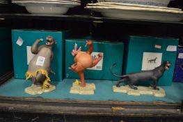 A set of three Doulton Jungle Book porcelain figures with original boxes.