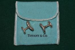 A pair of Tiffany & Co silver bean shaped cufflinks.