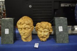 Two marble busts in the Roman style with pedestal bases.