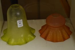 Two glass lamp shades.