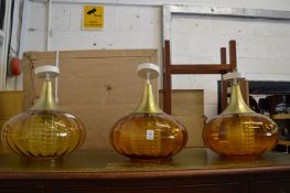 Three stylish light fittings.