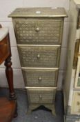 A pair of Eastern style silvered metal cupboard four drawer tapering chests.