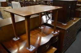 A walnut occasional table and a nest of tables.