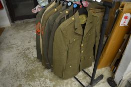 A collection of eight American military jackets.
