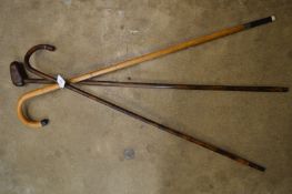 Three walking sticks.