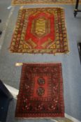 A Persian mat, 70cm x 52cm and a Persian rug, 115cm x 88cm.