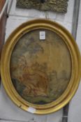 A 19th century silk work oval picture depicting a seated woman with sheep by her side.