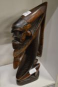 A pair of African carved wood figures.