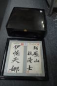 Chinese calligraphy picture and a lacquer stand.