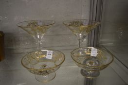 Two pairs of gilded glass pedestal dishes, one with small rim chip.