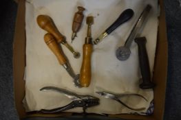 A collection of leather working tools.