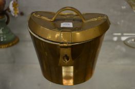 An unusual brass box with hinged cover modelled as an old hat box.