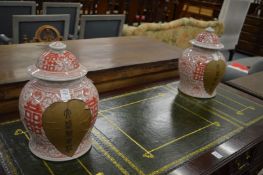 A pair of Chinese ginger jars and covers.