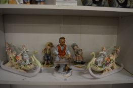 A pair of Continental porcelain centre pieces modelled as female figures on sledges together with