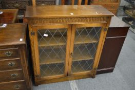 An oak two door bookcase.