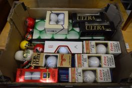 Quantity of golf balls, boxed.