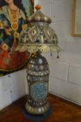 A large decorative Islamic porcelain and metal mounted lamp.