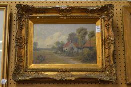 Rural landscape with cottages and a path, oil on canvas in a decorative gilt frame.