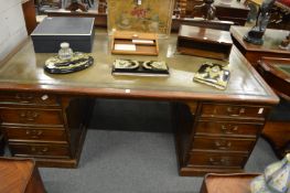 A large mahogany pedestal desk.