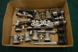 A collection of opera glasses with folding handles etc.