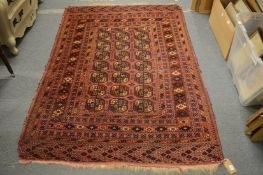 A small Persian bokhara rug, 190cm x 130cm.