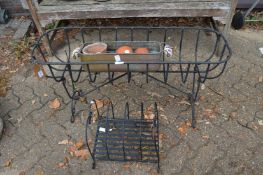 A wrought iron plant trough and other items.