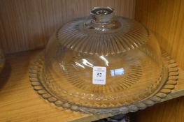 A cut glass circular dish and cover.