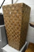 A large rattan planter.