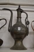 A large Islamic tinned copper ewer.
