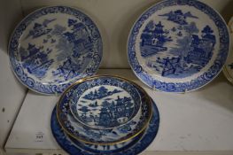A collection of blue and white porcelain saucers and plates.