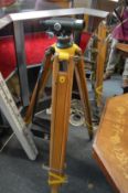 A Watts surveyors level with tripod and scale.