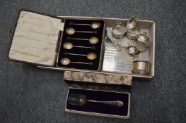 A group of small silverware to include cigarette case, coffee spoons, napkin rings etc.