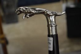 A walking stick, the handle modelled as a Jaguar car mascot.