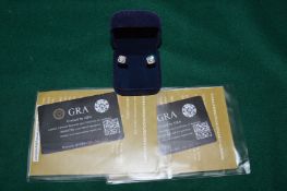 A pair of gilded silver and 2ct Moissanite studs with certificate, stones etched with certificate