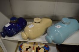 Three stoneware hot water bottles.