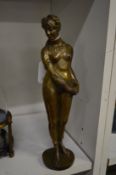 Bronze model of a standing female nude.