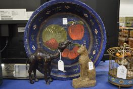 A carved stone Egyptian cat and two other items.