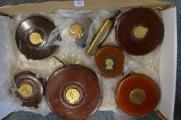 A good collection of leather cased and other tape measures.