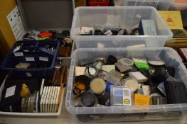 A large quantity of camera filters and accessories.