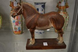 Calvin Roy Kinsder, a good carved and painted wood model of a dray horse on a wooden base.