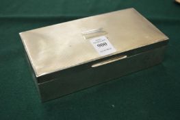 A silver cigarette box.