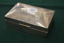 A silver cigarette box.