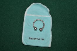 A Tiffany & Co silver ring.