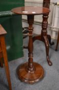 A mahogany jardiniere stand.