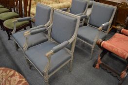 A set of four French style grey painted and upholstered armchairs.