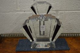 A large Art Deco style cut glass perfume bottle.