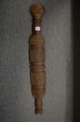 An African carved wood club.
