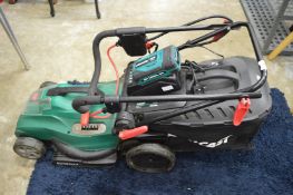 A Qualcast battery operated lawn mower.