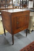 A 19th century mahogany washstand with bi-fold top.